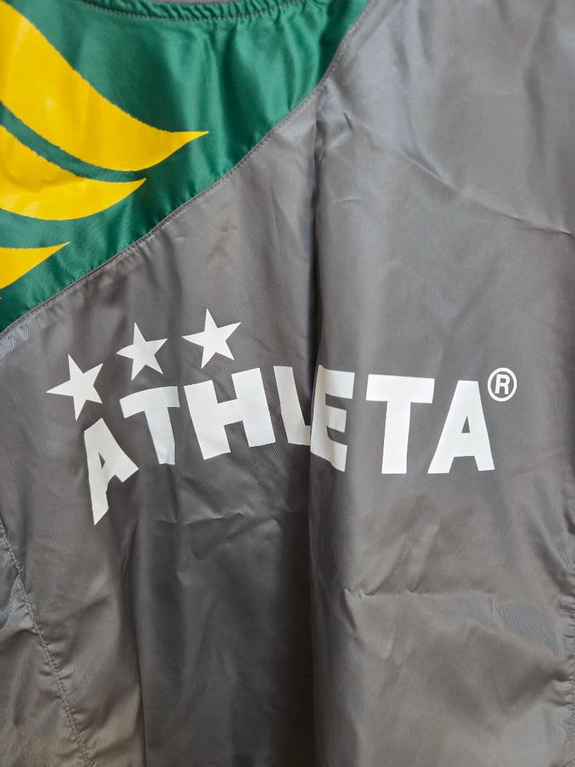 ATHLETA ピステ・ウィンドブレーカー グレー/グリーン