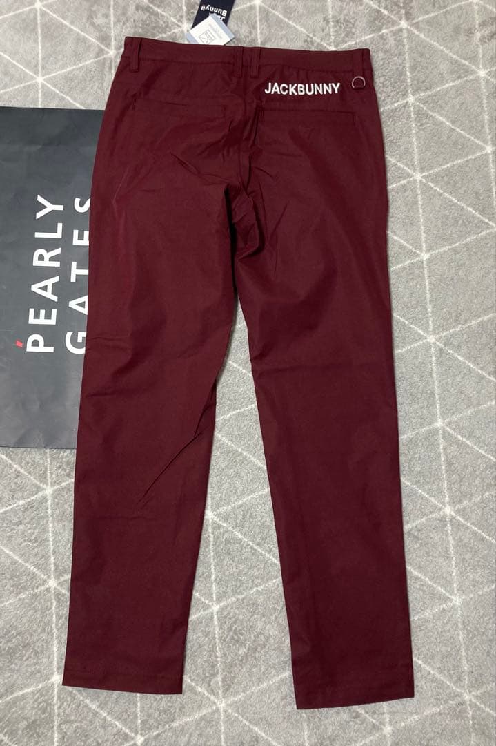 新品 パーリーゲイツ ジャックバニー ポリエステルツイル パンツ(5)L/ワイン