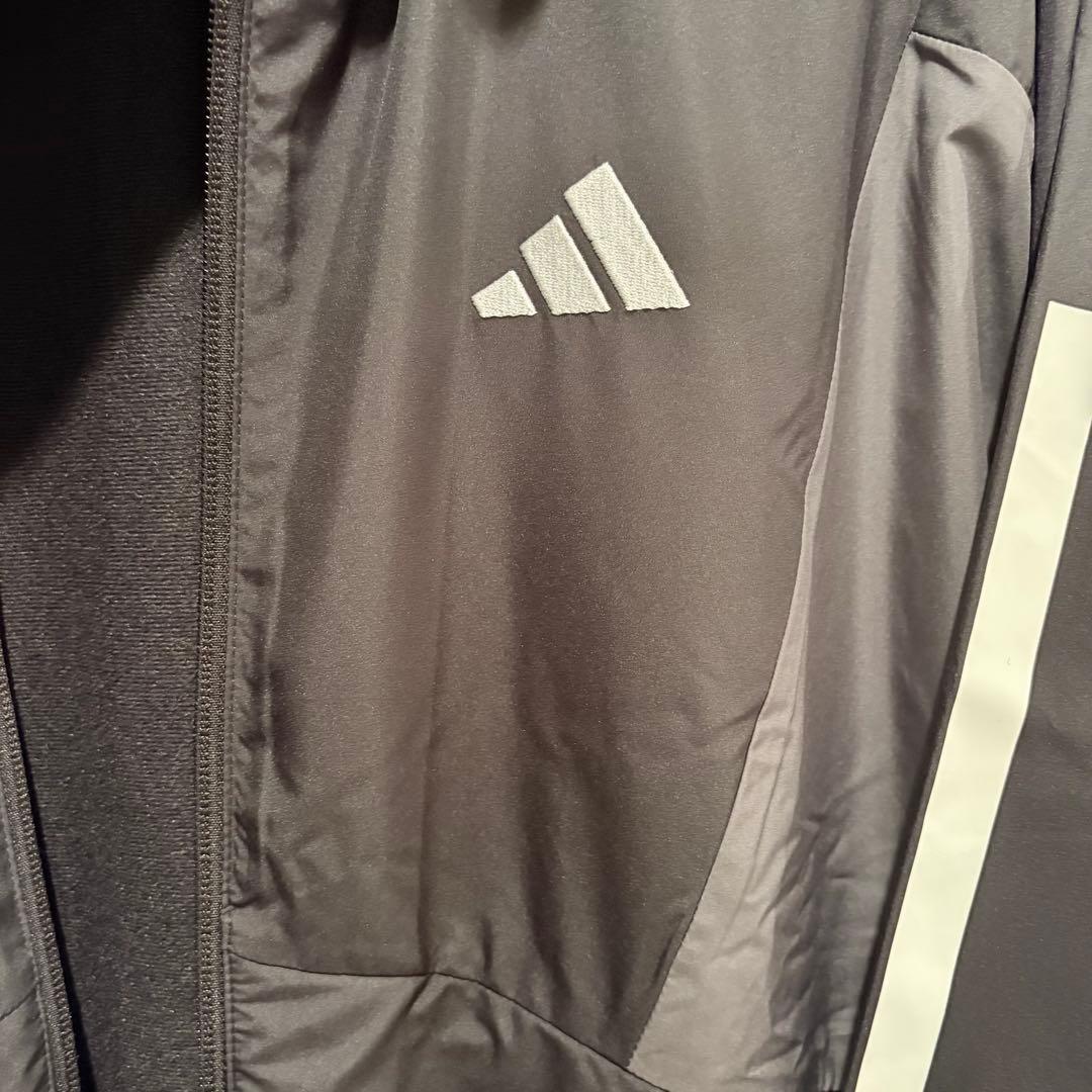 adidas レディースフード付きウィンドブレーカー 黒・グレー