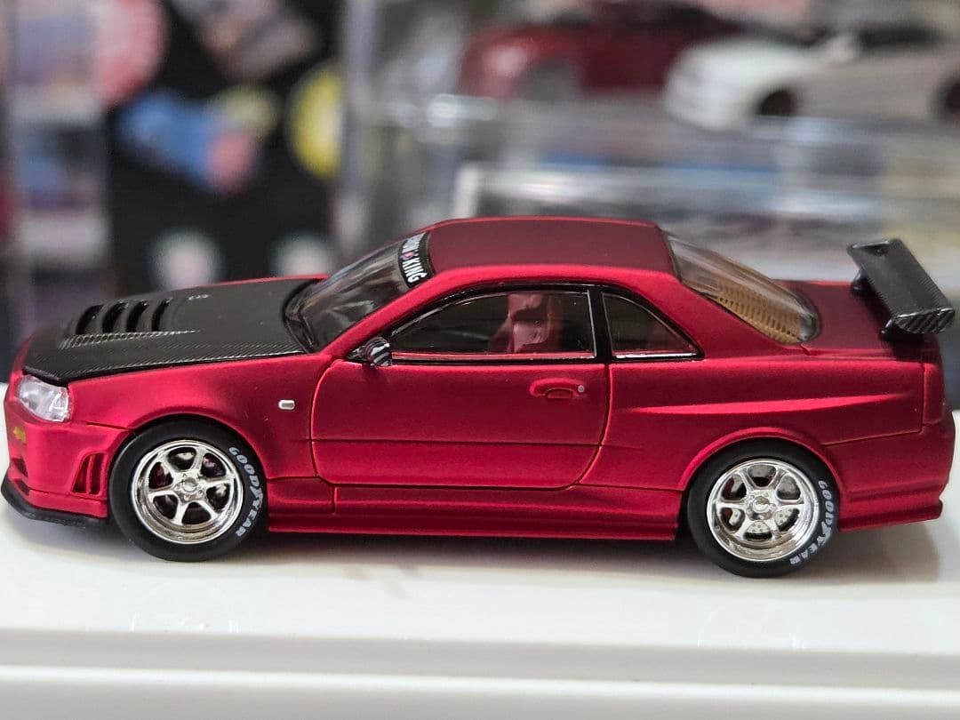 限定700台1/64車魔王AUTOEXPO2025日産スカイラインGT-R34赤