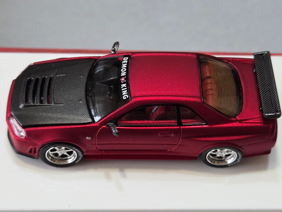限定700台1/64車魔王AUTOEXPO2025日産スカイラインGT-R34赤