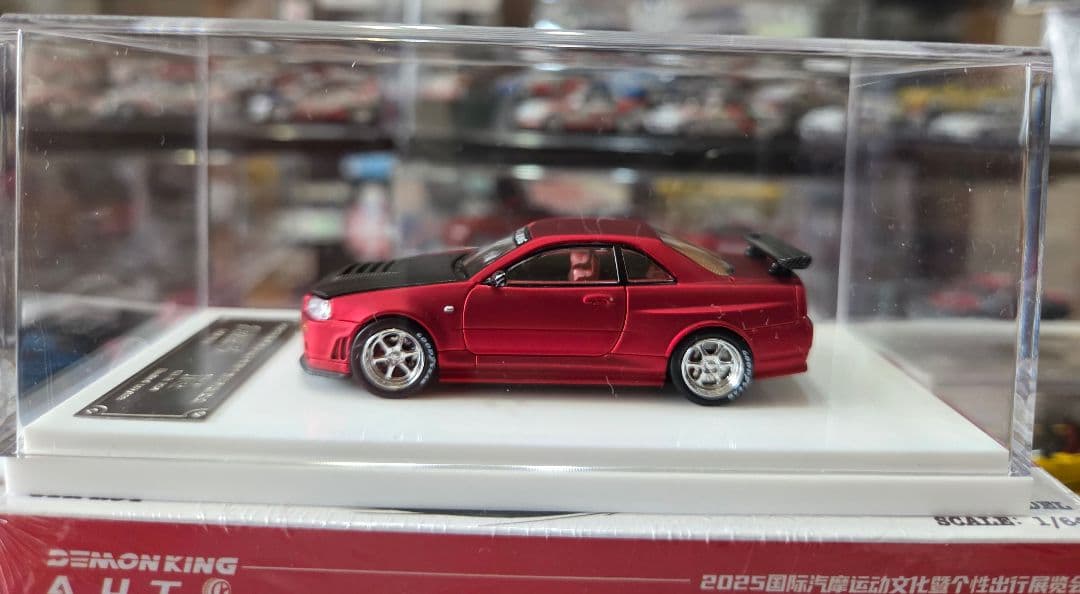 限定700台1/64車魔王AUTOEXPO2025日産スカイラインGT-R34赤