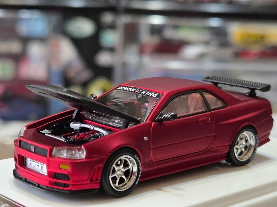 限定700台1/64車魔王AUTOEXPO2025日産スカイラインGT-R34赤