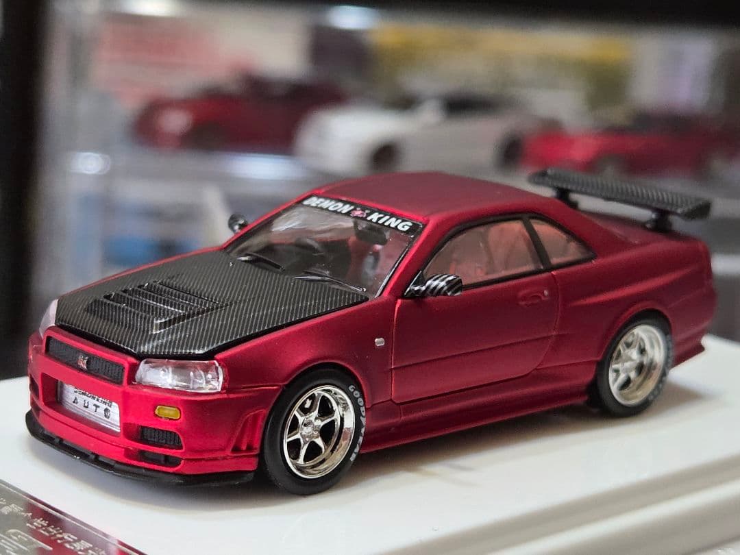 限定700台1/64車魔王AUTOEXPO2025日産スカイラインGT-R34赤
