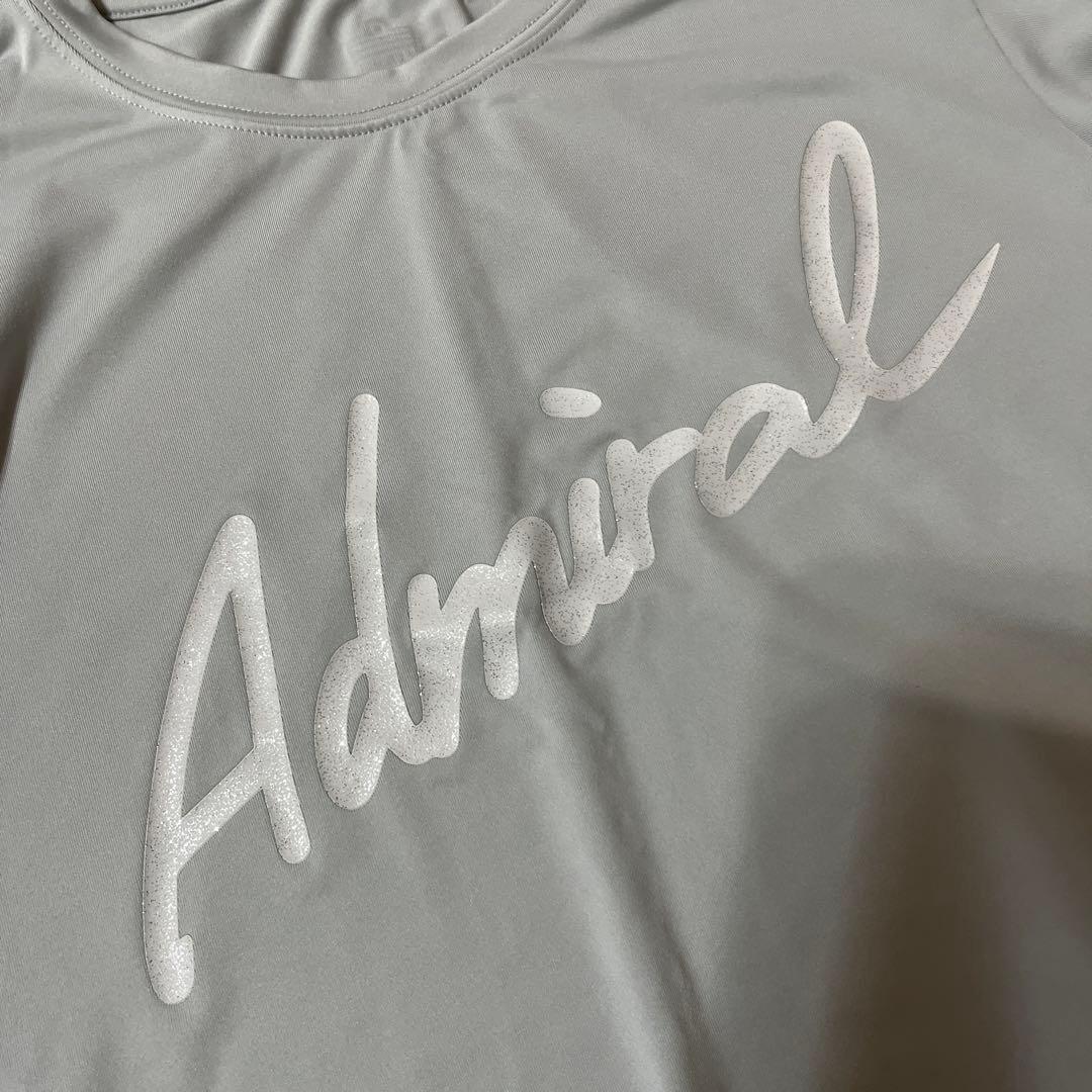 アドミラル ラメプリントスクリプトロゴL/S TEE ATLA31W グレーs