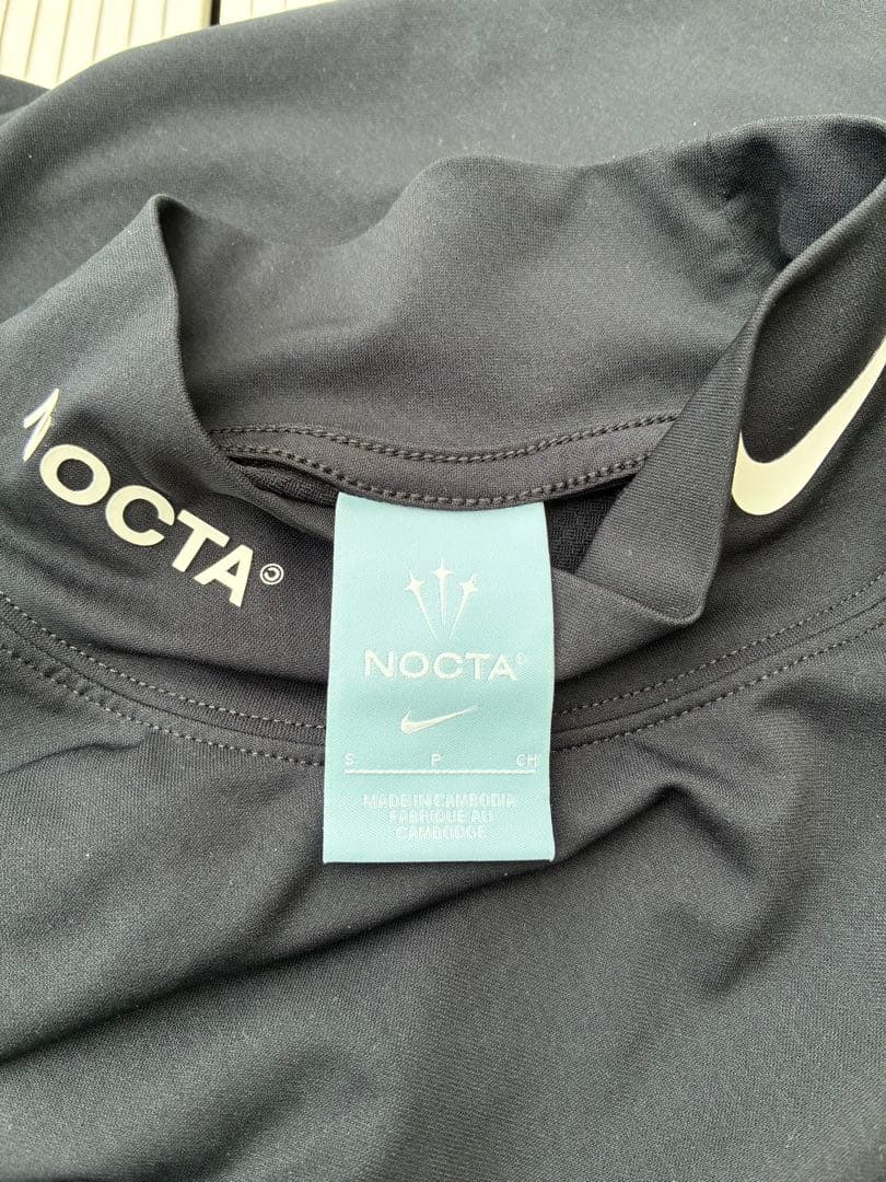 【中古】NOCTA NIKE モックネックシャツ ブラック Sサイズ