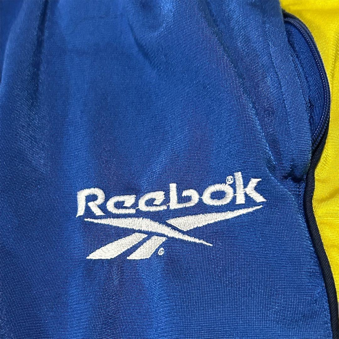 リーボック ReebokトラックパンツサイドスナップサッカーブレンビーIF青黄