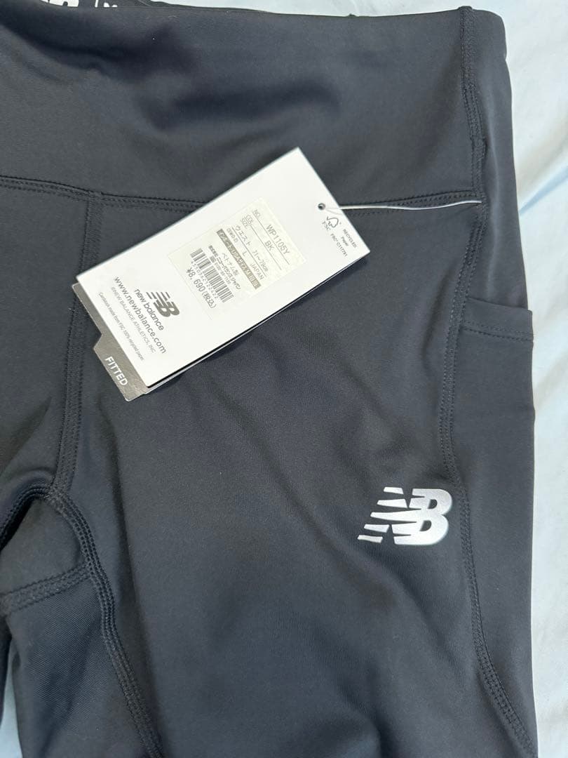 ニューバランス new balance スポーツウエアーズボン新品タグ付き。黒色