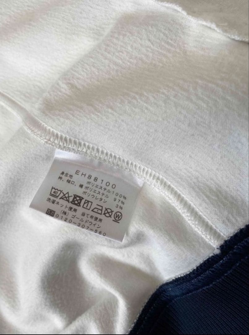 春にピッタリellesse ジップアップ ホワイト/ネイビー　Ｌ