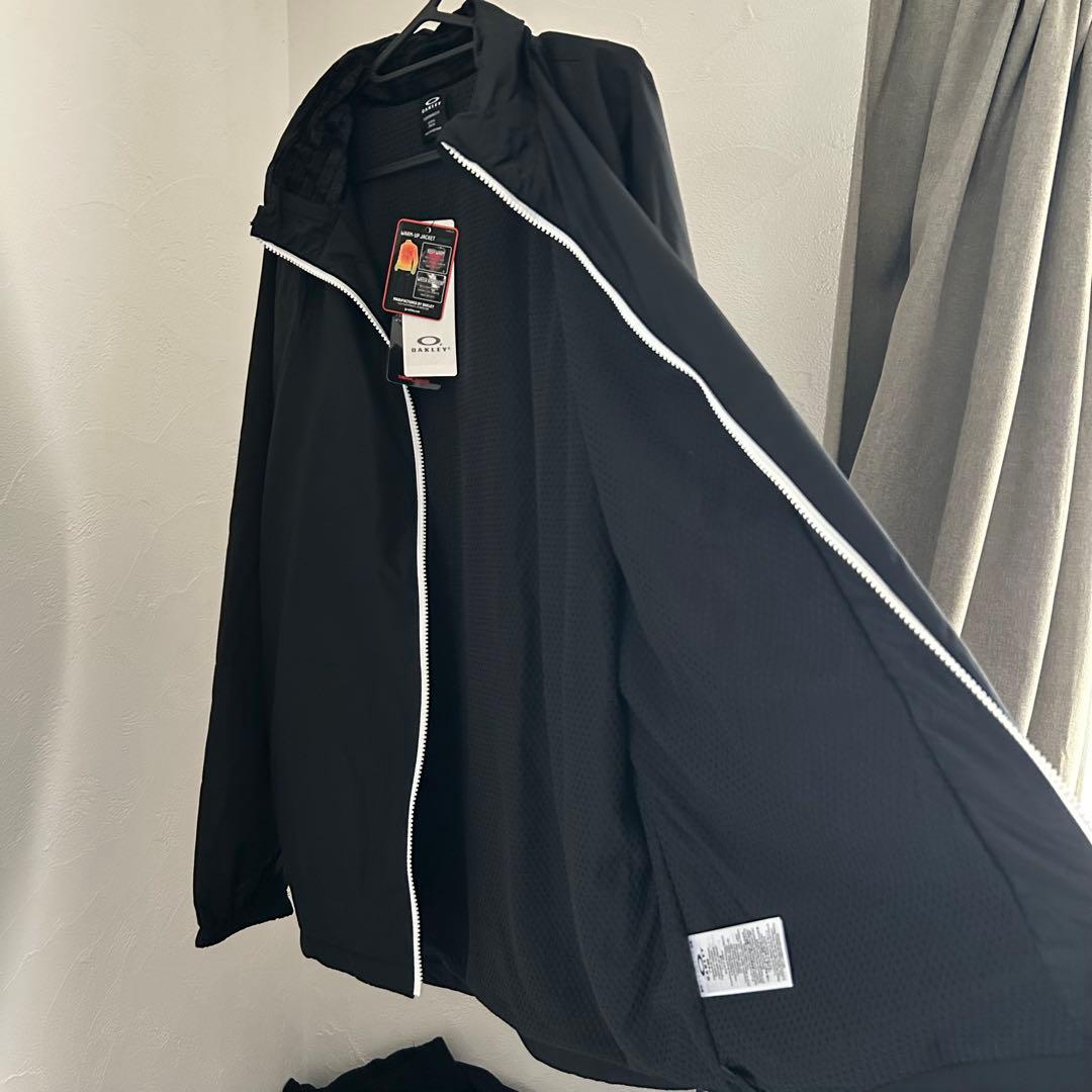 新品オークリー ENHANCE WIND WARM STAND JACKET