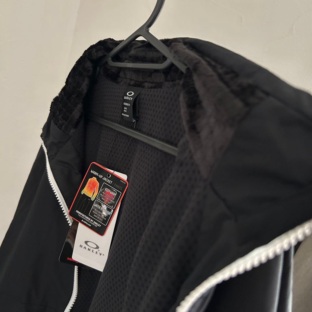 新品オークリー ENHANCE WIND WARM STAND JACKET