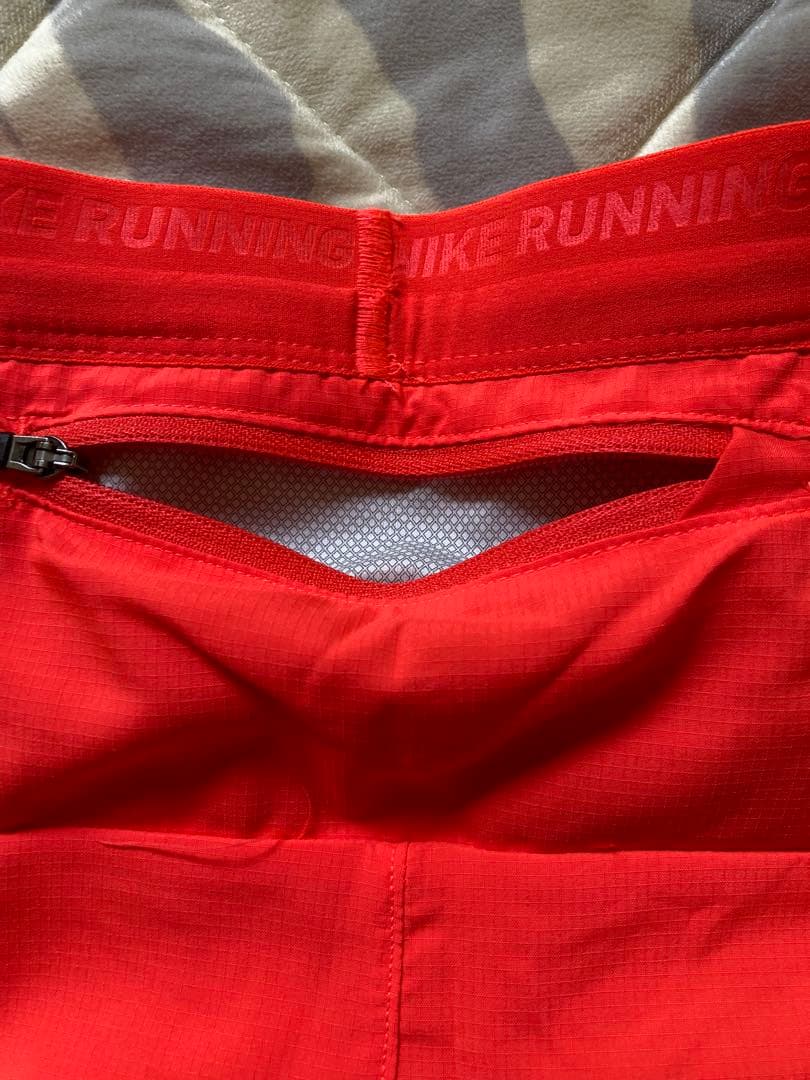 Nike Dri-FIT ストライド ショートパンツ オレンジ