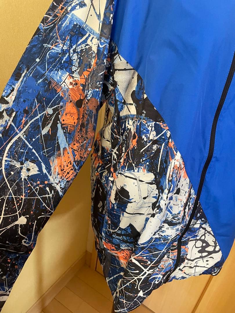 New Balance ニューバランス グラフィックウーブンジャケット