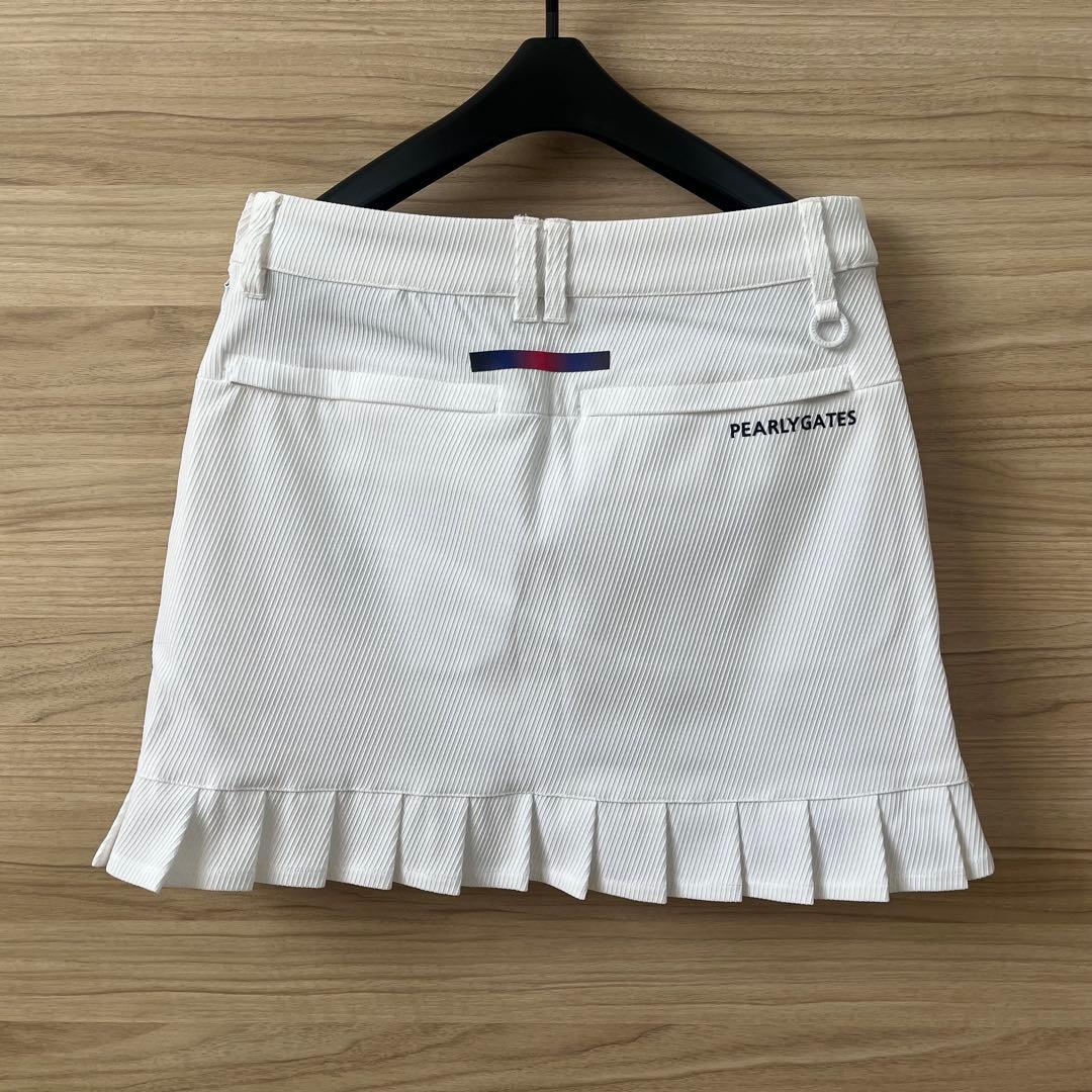 新品★28,600円 パーリーゲイツ 春夏ゴルフスカート 裾プリーズ 濃紺×白０