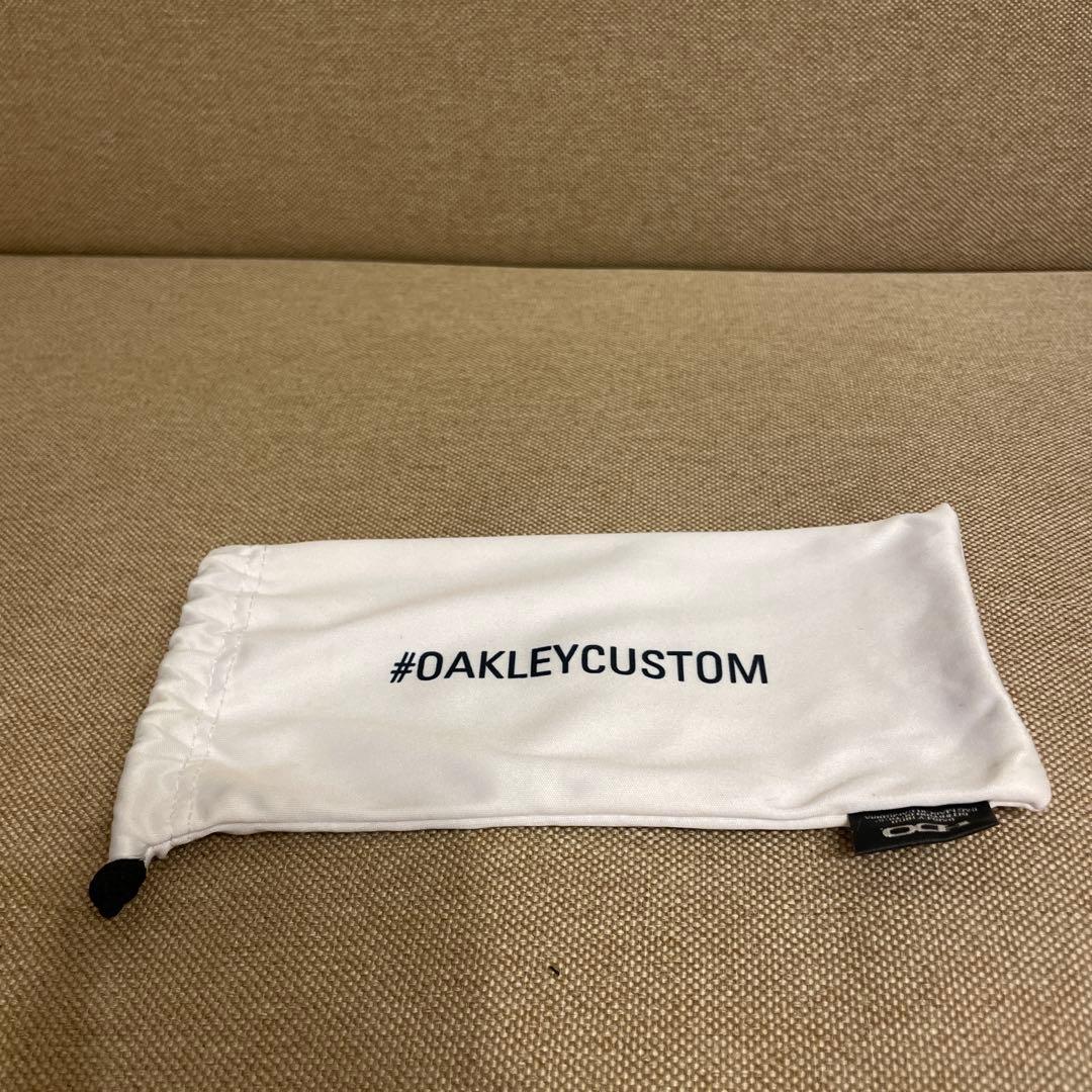 Oakley サングラス ブラックフレーム ゴールドレンズ