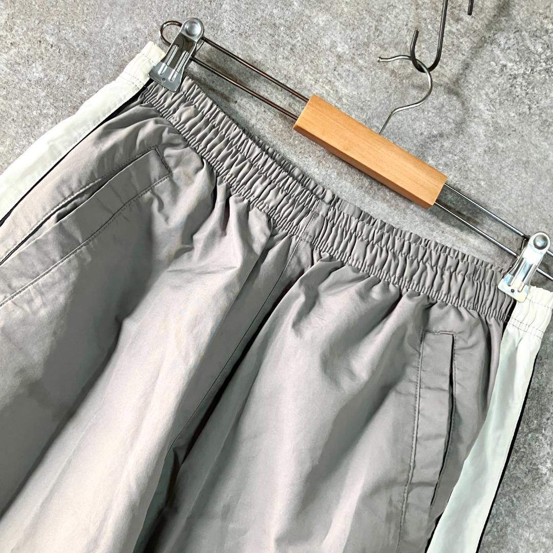NIKE　トラックパンツ　ジャージ　グレー　ロゴ　ライン　メッシュ　フィットネス