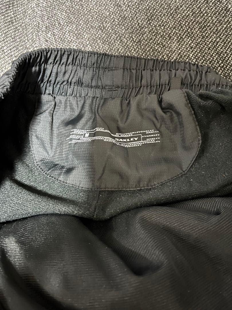 Oakley メンズジャケット パンツ セットアップ 黒 ピンク