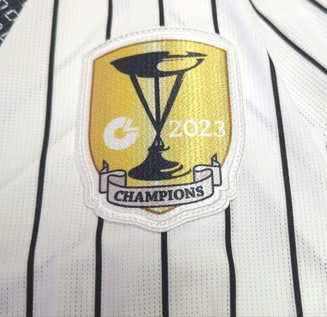 阪神タイガース　チャンピオン　エンブレム付き　ユニフォーム　佐藤輝明【Ｌサイズ】