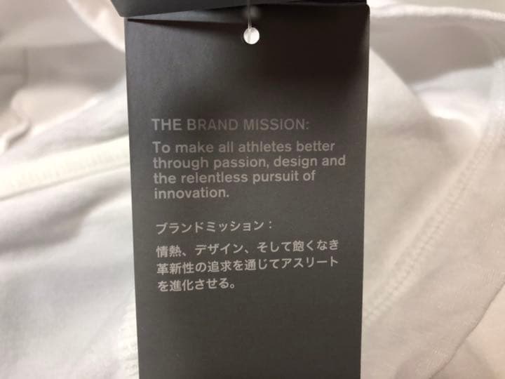 14アンダーアーマー◆1302922 ルーズ ブランドミッション XL白長袖上着