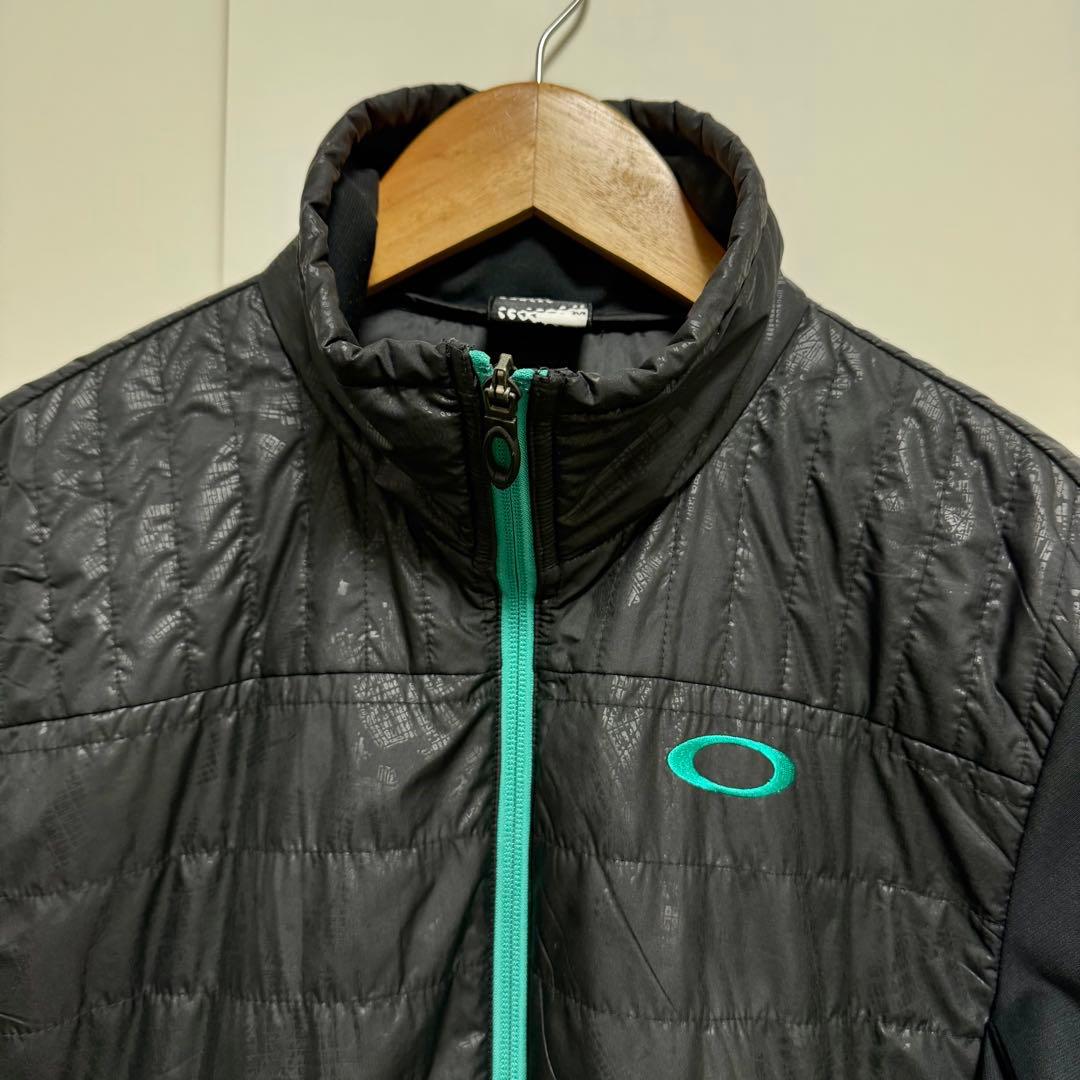 超美品 OAKLEY オークリー 中綿切替 ゴルフウェア ジャケット M